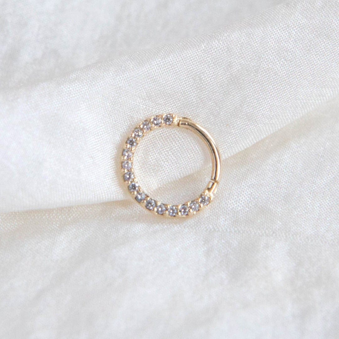 infinity daith hoop, a 14 carat solid gold classic circular hoop with ring of cubic zirconia 
